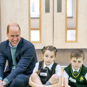 Le prince William, duc de Cambridge, et Catherine (Kate) Middleton, duchesse de Cambridge, lors d'une visite à l'école primaire St. John's, à Port Glasgow, Royaume Uni, le 11 mai 2022, pour participer à une session Roots of Empathy. 