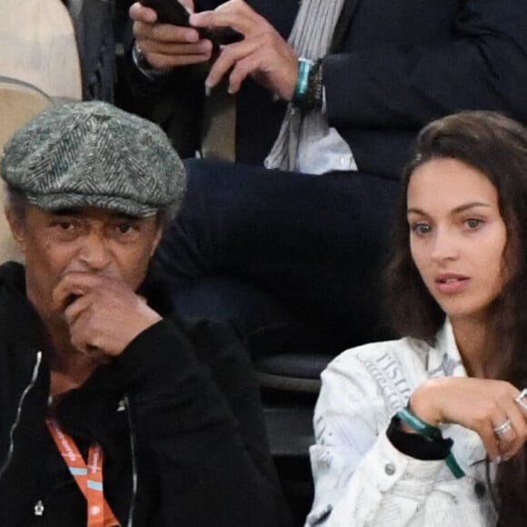 Yannick Noah et sa fille Jenaye Noah - Célébrités dans les tribunes des internationaux de France de Roland Garros à Paris le 30 mai 2022.