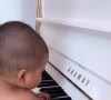 Slimane avec sa fille au piano, juin 2022.