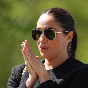 Le prince Harry et Meghan Markle lors du "Land Rover Challenge" au premier jour des Invictus Games 2020 à La Haye, le 16 avril 2022. 