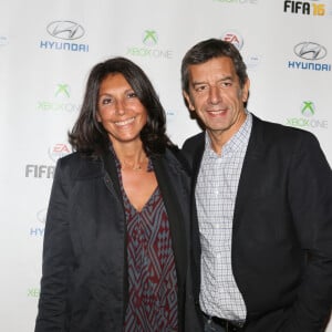 Michel Cymes et sa femme Nathalie - Soirée de lancement du jeu vidéo "FIFA 2016" au Faust à Paris, le 21 septembre 2015.