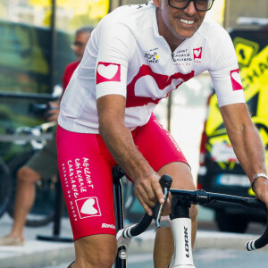 Paul Belmondo - Essais des vélos des personnalités participant à l'étape du coeur de l'association "Mécénat Chirurgie Cardiaque" (MCC) à l'Hôtel Ibis Centre lors du tour de France, St Etienne, France, le 14 juillet 2022. © Christophe Clovis / Bestimage 