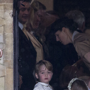 Le prince George de Cambridge, sa soeur Charlotte et la nounou Maria Borrallo - Mariage de P. Middleton et J. Matthew, en l'église St Mark Englefield, le 20 mai 2017.