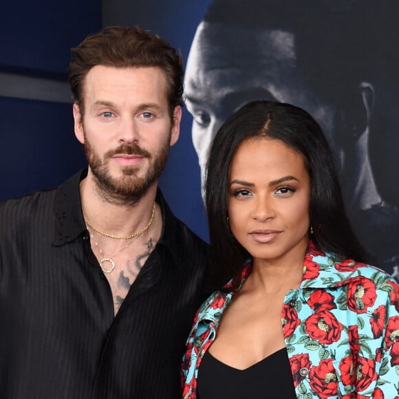 Christina Milian et son mari Matt Pokora au photocall de la première du film "Ambulance" à Los Angeles .