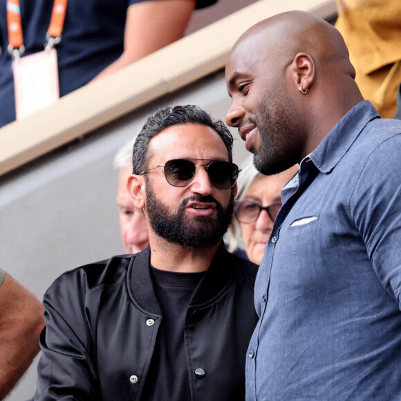 Cyril Hanouna, Teddy Riner dans les tribunes lors des Internationaux de France de Tennis de Roland Garros 2022. Paris, le 5 juin 2022. © Dominique Jacovides/Bestimage