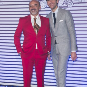 Mika et Christian Louboutin - Photocall de la soirée de vernissage de l'exposition "Jean Paul Gaultier" au Grand Palais à Paris, le 30 mars 2015.