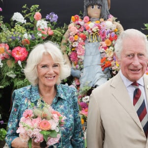 Le prince Charles, prince de Galles, et Camilla Parker Bowles, duchesse de Cornouailles, visitent l'exposition horticole "Sandringham Flower Show", le 27 juillet 2022. A cette occasion, le couple princier a rencontré des membres des forces armées. 