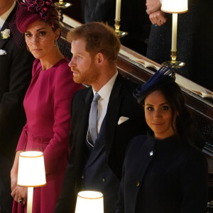 Catherine (Kate) Middleton, duchesse de Cambridge, Le prince Harry, duc de Sussex, et Meghan Markle, duchesse de Sussex - Cérémonie de mariage de la princesse Eugenie d'York et Jack Brooksbank en la chapelle Saint-George au château de Windsor, Royaume Uni le 12 octobre 2018. 