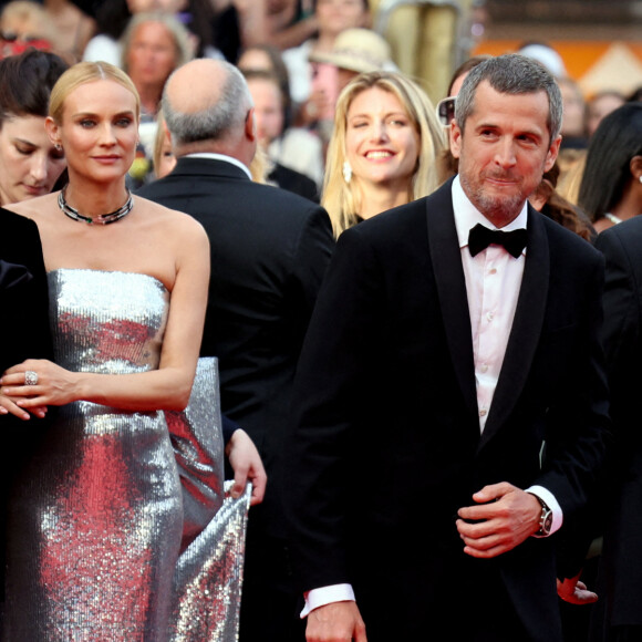 Diane Kruger, accompagné de son amoureux Norman Reedus, juste à côté de Guillaume Canet - Montée des marches pour la cérémonie de clôture du 75ème Festival International du Film de Cannes. Le 28 mai 2022