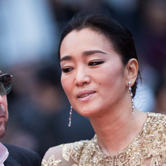 Jean-Michel Jarre et sa compagne Gong Li (robe Elie Saab)- Montée des marches du film "Douleur et Gloire" lors du 72ème Festival International du Film de Cannes. Le 17 mai 2019 © Jacovides-Moreau / Bestimage 