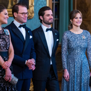 La princesse Victoria de Suède, Le prince Daniel de Suède, La princesse Sofia (Hellqvist) de Suède, Le prince Carl Philip de Suède, lors du dîner de gala annuel "Sverigemiddagen (dîner suédois)", suivi d'un concert dans la salle Rikssalen du palais royal à Stockholm, le 20 janvier 2023.