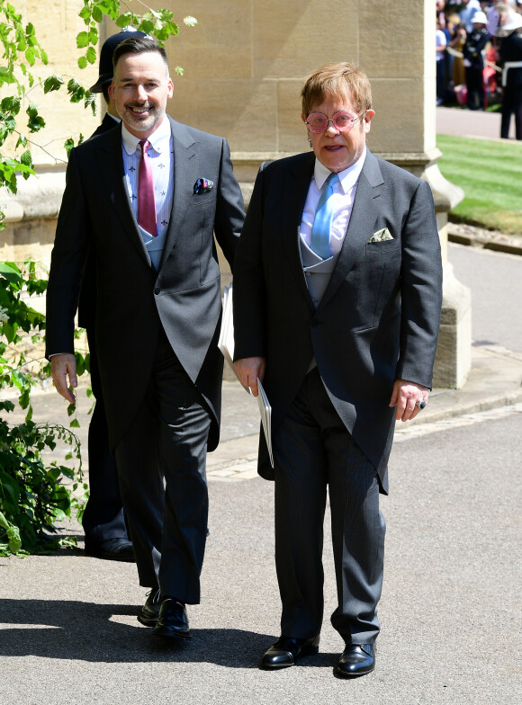 David Furnish et Elton John - Les invités à la sortie de la chapelle St. George au château de Windsor, Royaume Uni, le 19 mai 2018. 