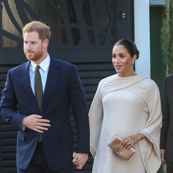Le prince Harry, duc de Sussex, et Meghan Markle, duchesse de Sussex, enceinte assistent à une réception organisée par l'ambassadeur britannique au Maroc, Thomas Reilly, à la résidence britannique de Rabat, le 24 février 2019, dans le cadre de leur voyage officiel au Maroc. 