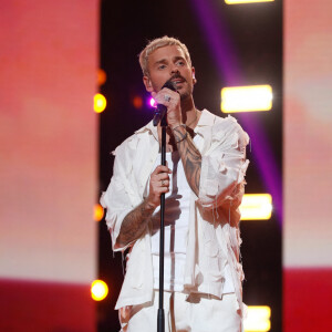 Exclusif - M. Pokora (Matt Pokora) chante son tube "Qui on est" - Enregistrement de l'émission "Les 20 chansons préférées 2022", diffusée le 5 janvier 2023 sur M6 © Christophe Clovis / Bestimage É.Gossuin vous invite à un grand show musical inédit au coeur du Dôme de Paris. Grâce à un grand sondage IFOP, découvrez le classement des 20 chansons de l'année préférées des Français. 20 chansons qui sont déjà devenues des tubes incontournables et que vous avez le plus plébiscitées en 2022 ! Au programme de cette soirée évènement, des prestations live exclusives et de nombreuses images qui retraceront une année riche en tubes. Retrouvez toutes les stars et toutes les chansons qui ont marqué l'année musicale ! Alors, quelle chanson avez-vous élue comme étant votre chanson préférée de l'année ?