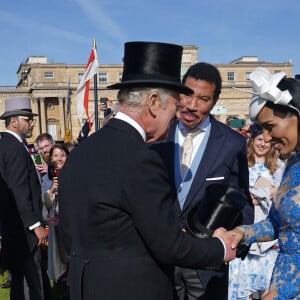 Et doivent avoir hâte d'assister au concert de Lionel Richie ce dimanche ! 
Le roi Charles III, Lionel Richie et sa compagne Lisa Parigi - Garden Party au palais de Buckingham à Londres. Le 3 mai 2023 