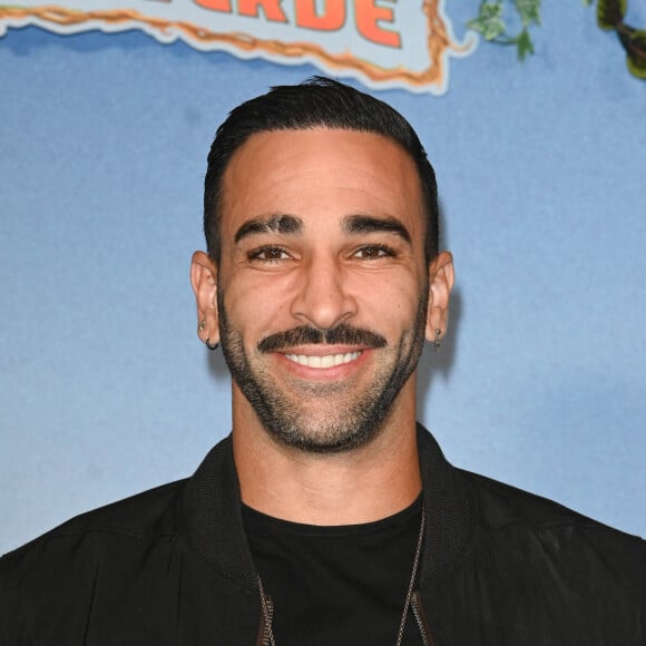 Depuis le mois de mars, Adil Rami et Léna Guillou sont de nouveau en couple, après une séparation en septembre 2022
 
Adil Rami - Avant-première du film "Jack Mimoun et les secrets de Val Verde" au Grand Rex à Paris le 26 septembre 2022. © Coadic Guirec/Bestimage