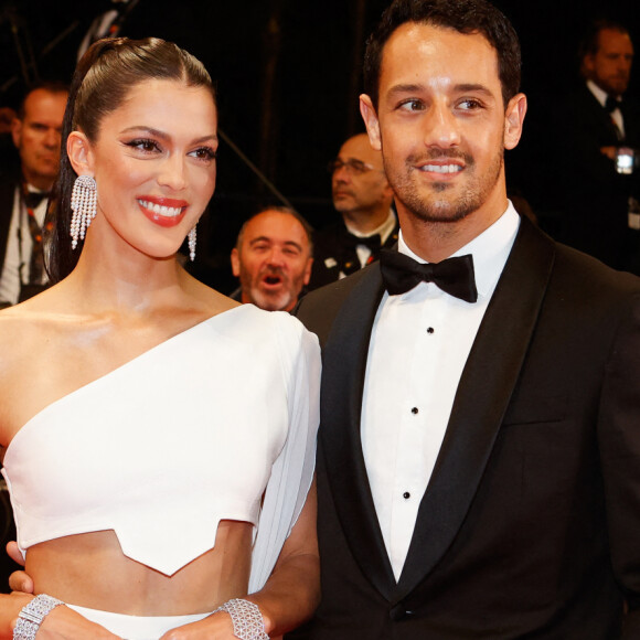 Iris Mittenaere a fait une apparition remarquée 
Iris Mittenaere et son fiancé Diego El Glaoui - Montée des marches du film " Le retour (Homecoming) " lors du 76ème Festival International du Film de Cannes, au Palais des Festivals à Cannes. © Christophe Clovis / Bestimage 