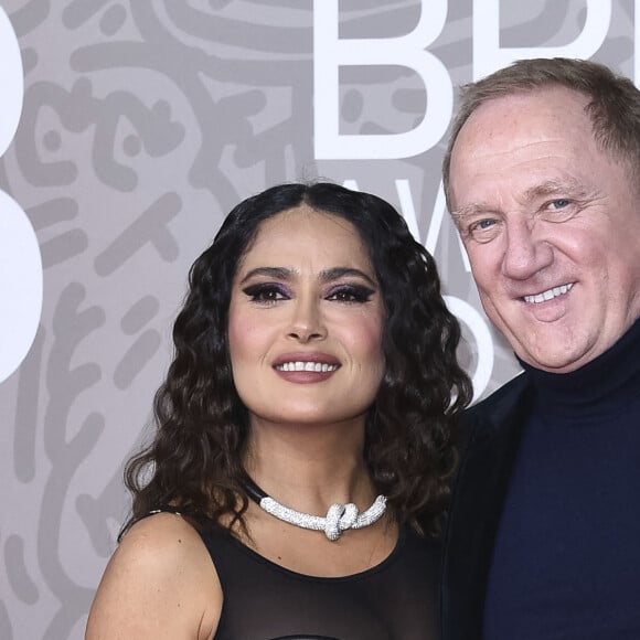 Salma Hayek et son mari Francois-Henri Pinault au photocall de la cérémonie des Brit Awards 2023 à l'O2 Arena à Londres le 11 février 2023.