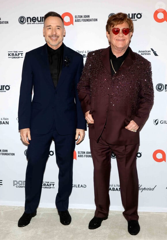 Devant son mari David Furnish et différents invités dont Lenny Kravitz.
David Furnish, Elton John à la soirée "Elton John AIDS Foundation" lors de la 95ème édition de la cérémonie des Oscars à Los Angeles le 12 mars 2023. 