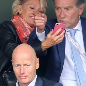 Sophie Davant et William Leymergie - People dans les tribunes des Internationaux de France de tennis de Roland Garros à Paris. Le 26 mai 2015