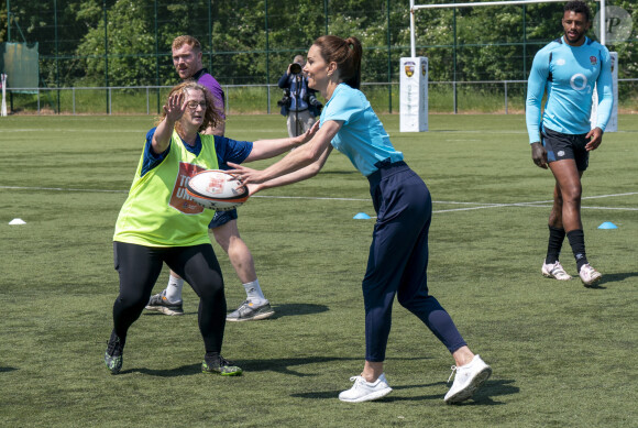 Et les soutient depuis longtemps.
Catherine Kate Middleton, princesse de Galles, participe à des exercices de rugby lors d'une visite au Maidenhead Rugby Club, dans le Berkshire, le 7 juin 2023. 