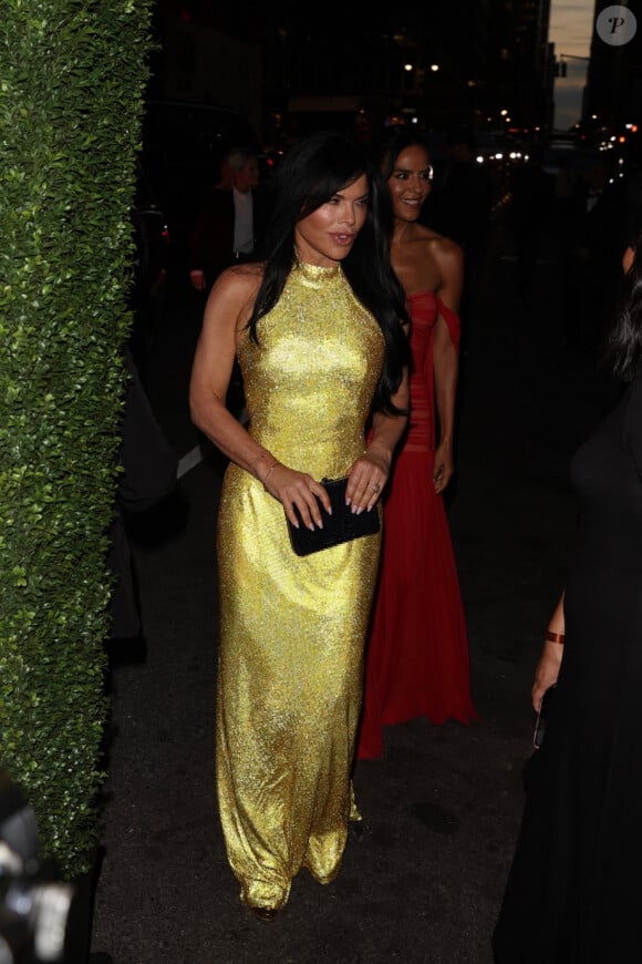 New York City, NY - Lauren Sanchez dazzles in a striking golden dress at the Kering Foundation's second annual Caring for Women dinner, celebrating the organization's 15th anniversary. Pictured: Lauren Sanchez 
