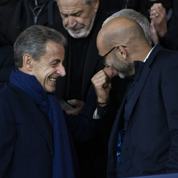 Nicolas Sarkozy et Jean-Claude Darmon- People dans les tribunes lors du match de ligue des champions entre le PSG et l'AC Milan au Parc des Princes à Paris le 25 octobre 2023. © Cyril Moreau/Bestimage