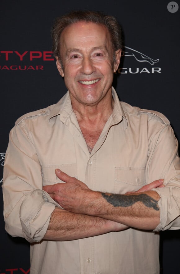 Gerard Klein pose pour le lancement de la nouvelle jaguar F-Type à Paris a L'atrium Banque. France le 31 Janvier 2013