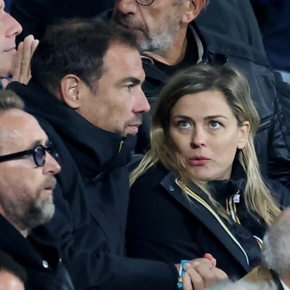 Laure Boulleau enceinte et Bruno Cheyrou - People des les tribunes de la coupe du Monde de Rugby France 2023 - Match de quart de finale "France-Afrique du Sud (28-29)" au Stade de France à Saint-Denis 15 octobre 2023. © Moreau-Jacovides/Bestimage