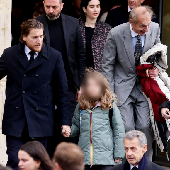 Nicolas Sarkozy et sa femme Carla Bruni Sarkozy, Jean Sarkozy et ses enfants - Sorties des obsèques de Päl Sarkozy de Nagy Bocsa, le père de Nicolas Sarkozy, en l'église Saint-Jean Baptiste à Neuilly sur Seine le 9 mars 2023. © Dominique Jacovides / Bestimage