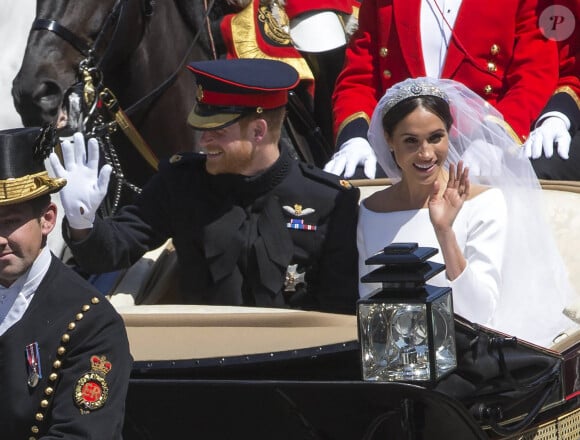 Le prince Harry, duc de Sussex, et Meghan Markle, duchesse de Sussex, en calèche au château de Windsor après la cérémonie de leur mariage au château de Windsor, Royaume Uni, le 19 mai 2018. 