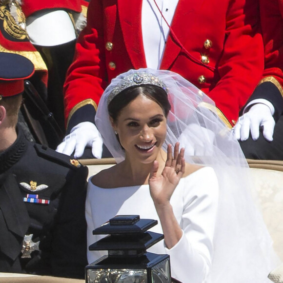 Le prince Harry, duc de Sussex, et Meghan Markle, duchesse de Sussex, en calèche au château de Windsor après la cérémonie de leur mariage au château de Windsor, Royaume Uni, le 19 mai 2018. 