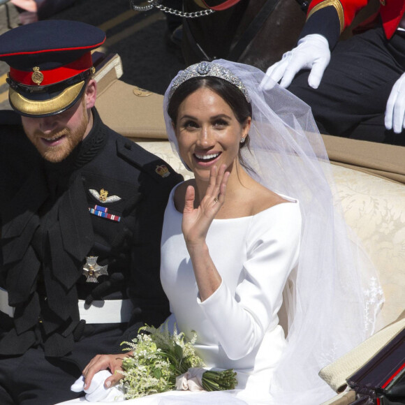 Le prince Harry, duc de Sussex, et Meghan Markle, duchesse de Sussex, en calèche au château de Windsor après la cérémonie de leur mariage au château de Windsor, Royaume Uni, le 19 mai 2018. 