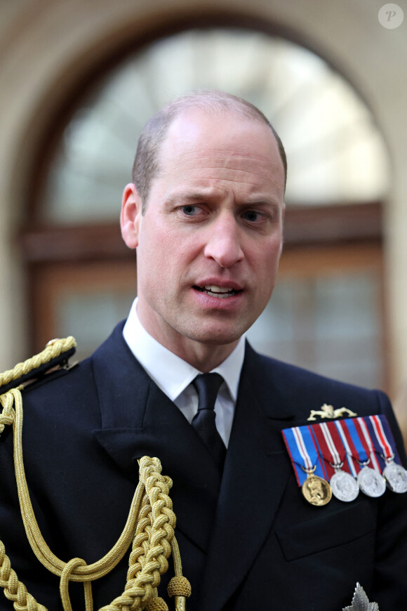 Le prince William de Galles assiste aux divisions du Lord High Admiral au Britannia Royal Naval College à Dartmouth, pour assister à un défilé de 202 cadets de la Royal Navy avec des élèves-officiers internationaux d'Oman, du Koweït, du Bangladesh et de Trinité-et-Tobago, au Royaume Uni, le jeudi 14 décembre 2023. 