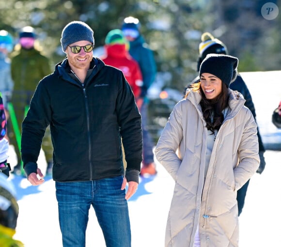 Le prince Harry, duc de Sussex et Meghan Markle, duchesse de Sussex, en visite au camp d'entrainement des athlètes des Invictus Games 2024 à Whistler en Colombie Britannique, le 14 février 2024. 