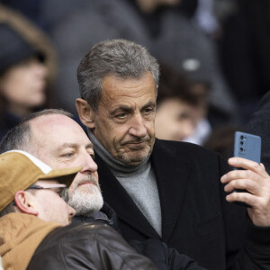 Nicolas Sarkozy - People dans les tribunes du match de Ligue 1 Uber Eats "PSG-Rennes" (1-1) au Parc des Princes à Paris le 25 février 2023. © Cyril Moreau/Bestimage 