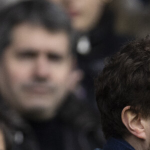 Clément Beaune et Nicolas Sarkozy - People dans les tribunes du match de Ligue 1 Uber Eats "PSG-Rennes" (1-1) au Parc des Princes à Paris le 25 février 2023. © Cyril Moreau/Bestimage 