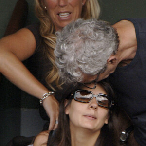 Raymond Domenech, entraîneur de l'équipe de France de football, et sa compagne Estelle Denis assistent au match de la finale masculine de Roland Garros à Paris, France, le 10 juin 2007. L'Espagnol Nadal a gagné contre le Suisse Federer 6-3, 4-6, 6-3, 6-4. Photo par Gorassini-Gouhier-Guignebourg-Guibbaud/ABACAPRESS.COM