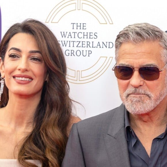 George Clooney et sa femme Amal Clooney arrivent à la soirée "Prince's Trust Awards à Londres, le 15 mai 2023. 