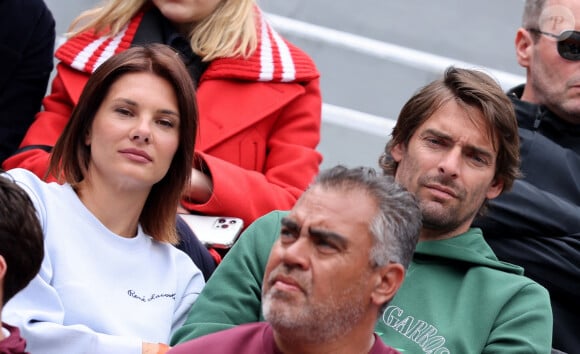 Camille Lacourt et sa compagne Alice Detollenaere dans les tribunes des Internationaux de France de tennis de Roland Garros 2024 à Paris, France, le 2 juin 2024. © Jacovides-Moreau/Bestimage 