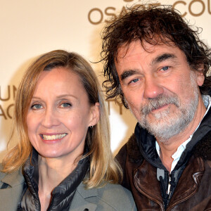 Olivier Marchal et Catherine à l'avant-première du film "Un été à Osage County" à l'UGC Normandie à Paris, le 13 février 2014.