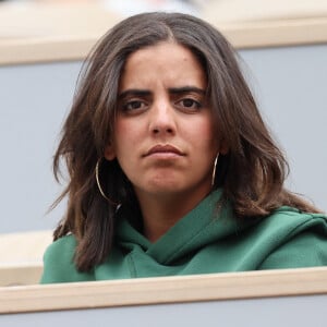 Nouvelle coqueluche de TF1, Inès Reg devait jouer le rôle principal de la nouvelle fiction de la chaîne, "Ado mais pas trop". 
Inès Reg (Inès Reghioua) dans les tribunes des Internationaux de France de tennis de Roland Garros à Paris, France. © Jacovides-Moreau/Bestimage