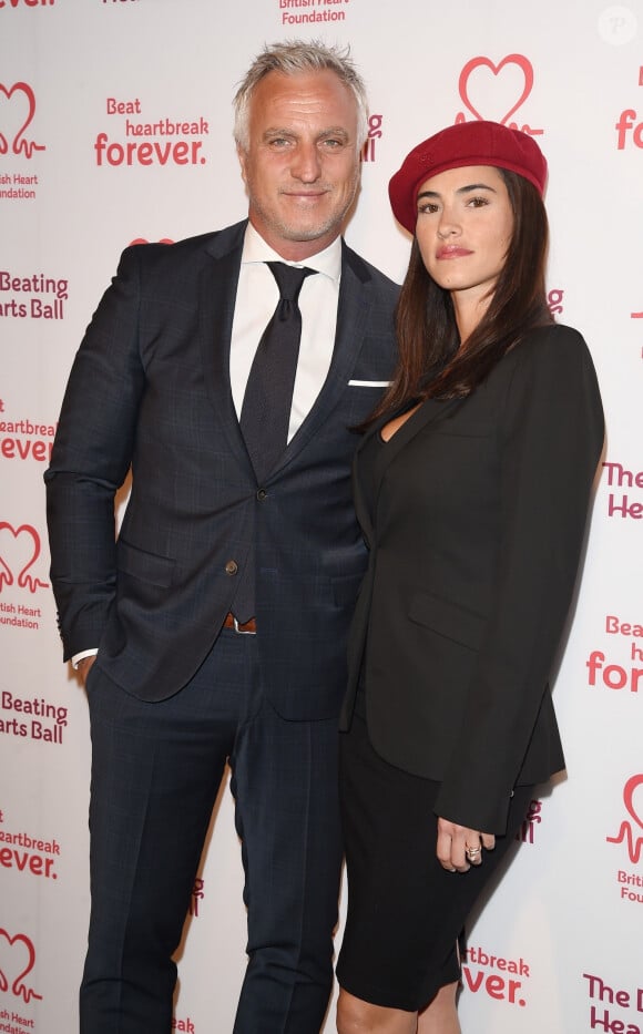 L'ancien footballeur est en couple avec Maëva Denat, avec qui il a une petite fille
 
David Ginola et sa compagne Maeva Denat arrivent à la soirée "The Beating Hearts Ball" à Londres, le 27 février 2019.
