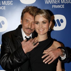  Johnny Hallyday sera incarné au cinéma dans un biopic initié par sa veuve Laeticia.
En France, à Paris, Johnny Hallyday et sa femme Laeticia lors de la soirée de Noël de Warner Music