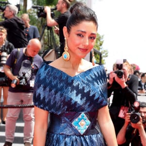 Golshifteh Farahani (Habillée par Araz Fazeli) - Montée des marches du film " The seed of the sacred fig " lors du 77ème Festival International du Film de Cannes, au Palais des Festivals à Cannes. Le 24 mai 2024 © Jacovides-Moreau / Bestimage 