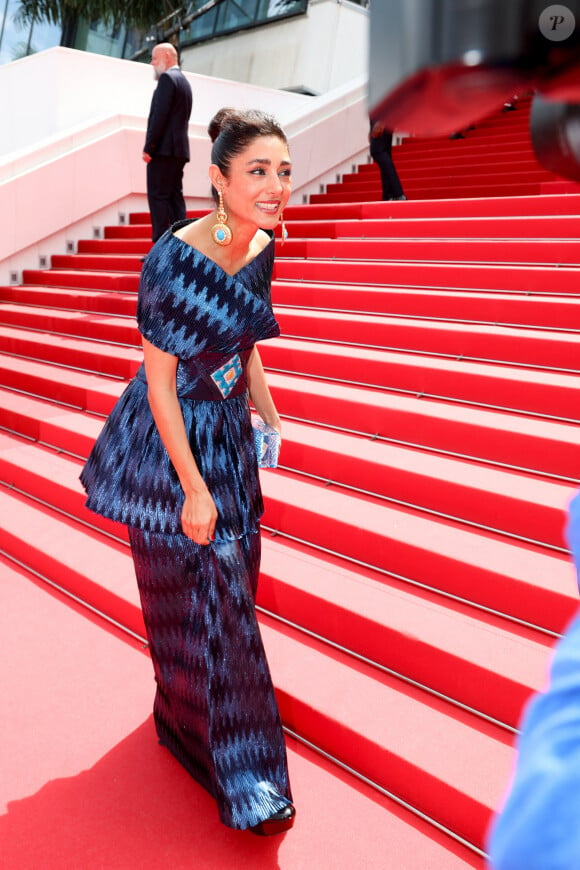 Golshifteh Farahani (Habillée par Araz Fazeli) - Montée des marches du film " The seed of the sacred fig " lors du 77ème Festival International du Film de Cannes, au Palais des Festivals à Cannes. Le 24 mai 2024 © Jacovides-Moreau / Bestimage 