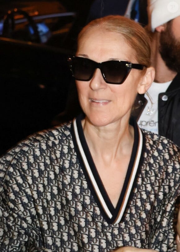 Paris, FRANCE - Celine Dion greets a large crowd of fans as she exits her hotel with her son RC Angelil in Paris, France Pictured: Celine Dion