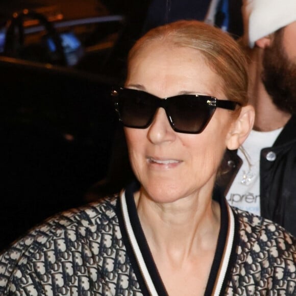 Paris, FRANCE - Celine Dion greets a large crowd of fans as she exits her hotel with her son RC Angelil in Paris, France Pictured: Celine Dion