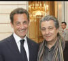 Exclusif - Nicolas Sarkozy et Christian Clavier - Cérémonie de remise des insignes de commandeur de l'ordre national du mérite à Mireille Darc à l'Elysée le 21 avril 2010.