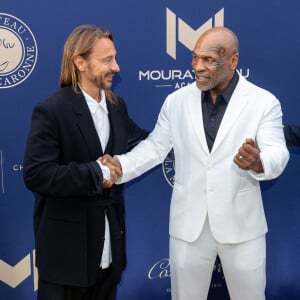 Bob Sinclar et Mike Tyson lors du 10ème anniversaire du Mouratoglou Annual Charity Gala. A la Mouratoglou Tennis Academy, Sofia Antipolis, France, le 23 juin 2024. Photo par Cyril Chateau/BACAPRESS.COM